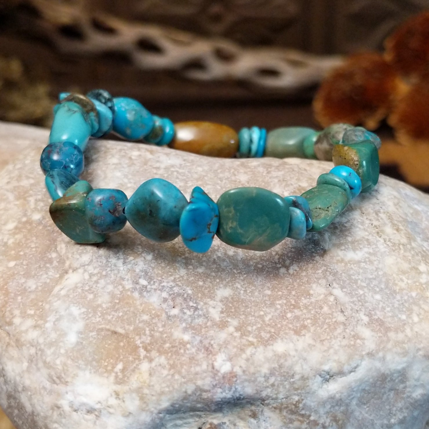 Bracelet with turquoise beaded along the elastic band.