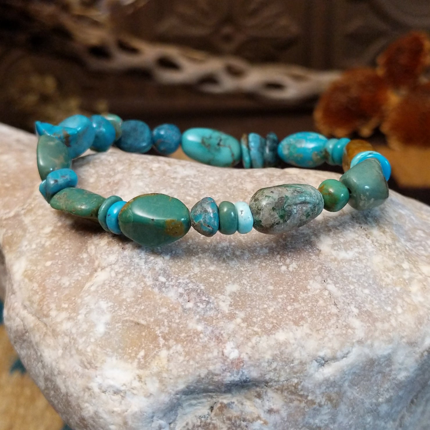 Bracelet with turquoise beaded along the elastic band.