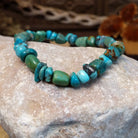 Bracelet with turquoise beaded along the elastic band.
