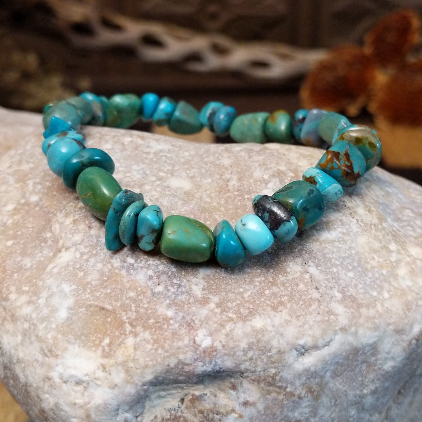 Bracelet with turquoise beaded along the elastic band.