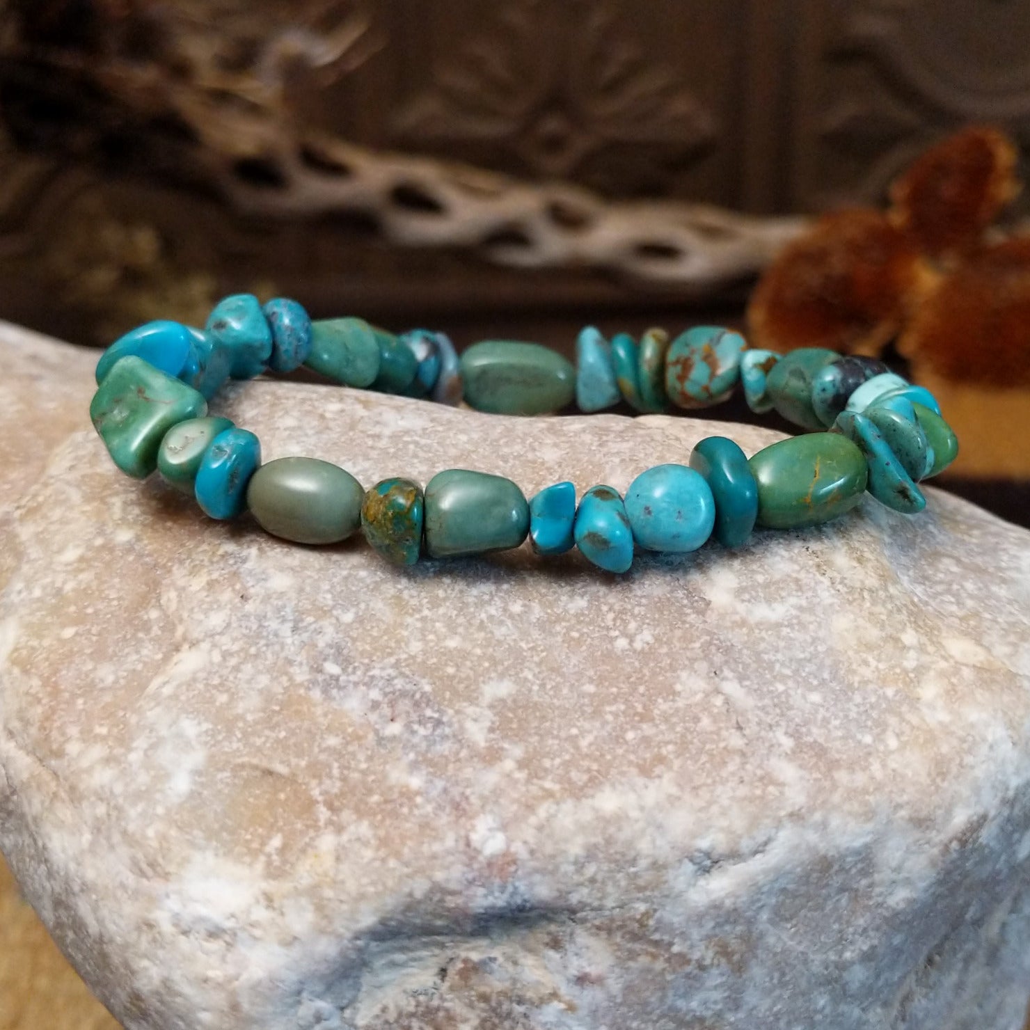 Bracelet with turquoise beaded along the elastic band.