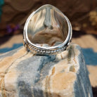 Sterling silver ring with turquoise set in clusters of notched bezels.