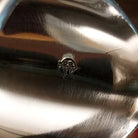 Close-up of the artisan's stamped signature.
