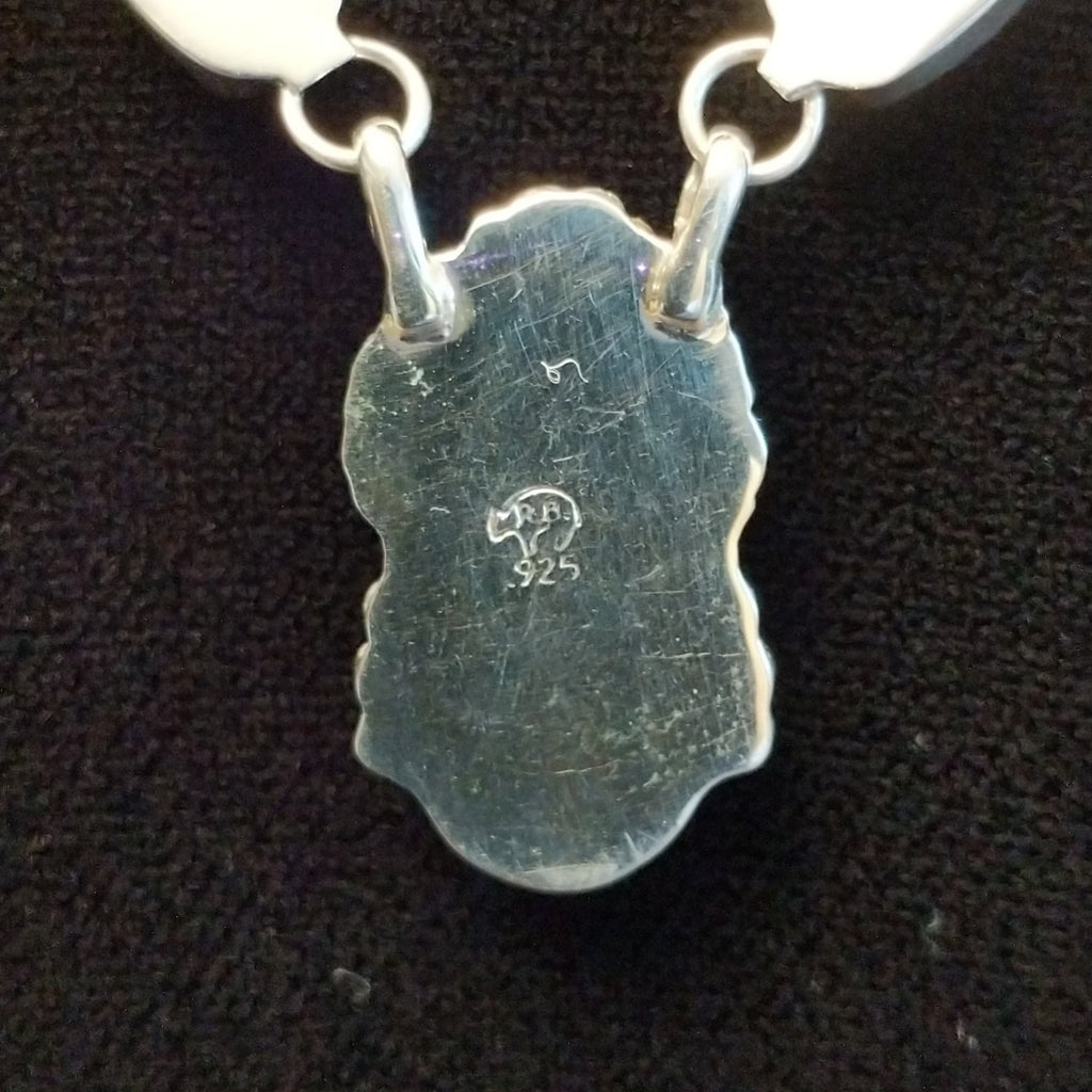 Close-up of the sterling silver authentication stamp.