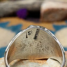 Sterling silver Navajo ring by S. featuring genuine turquoise and red coral cabochons, silver raindrop accents, and a split-shank Southwestern design; artisan and Sterling Silver stamp.