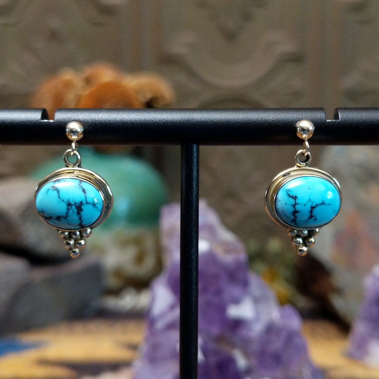 14kt gold Navajo earrings with oval turquoise and gold bead accents.