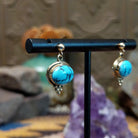14kt gold Navajo earrings with oval turquoise and gold bead accents.