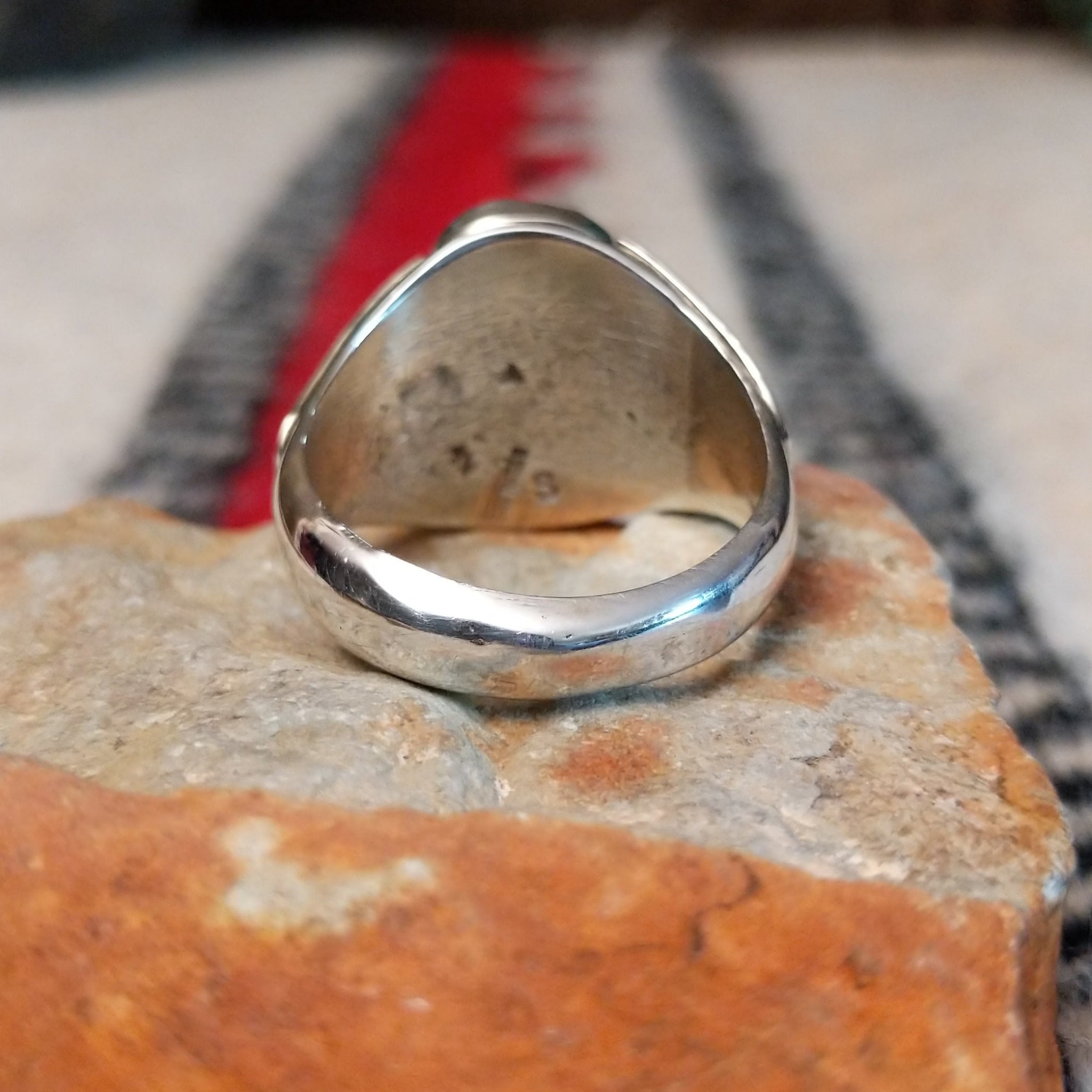 Navajo Turquoise Duo Ring by S. featuring two bright blue turquoise stones with dark matrix, silver bead accents, and a wide detailed silver band; underside view.