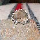 Navajo turquoise silver ring with dimensional eagle design.