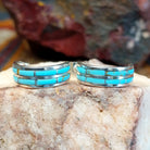 Sterling silver half hoop earrings with inlaid turquoise.