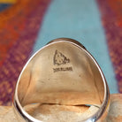 Navajo Turquoise Mosaic Ring featuring an oval face filled with geometric turquoise pieces in blue, aqua, sage, and green tones, set in a wide polished silver band; artisan and Sterling Silver stamp.