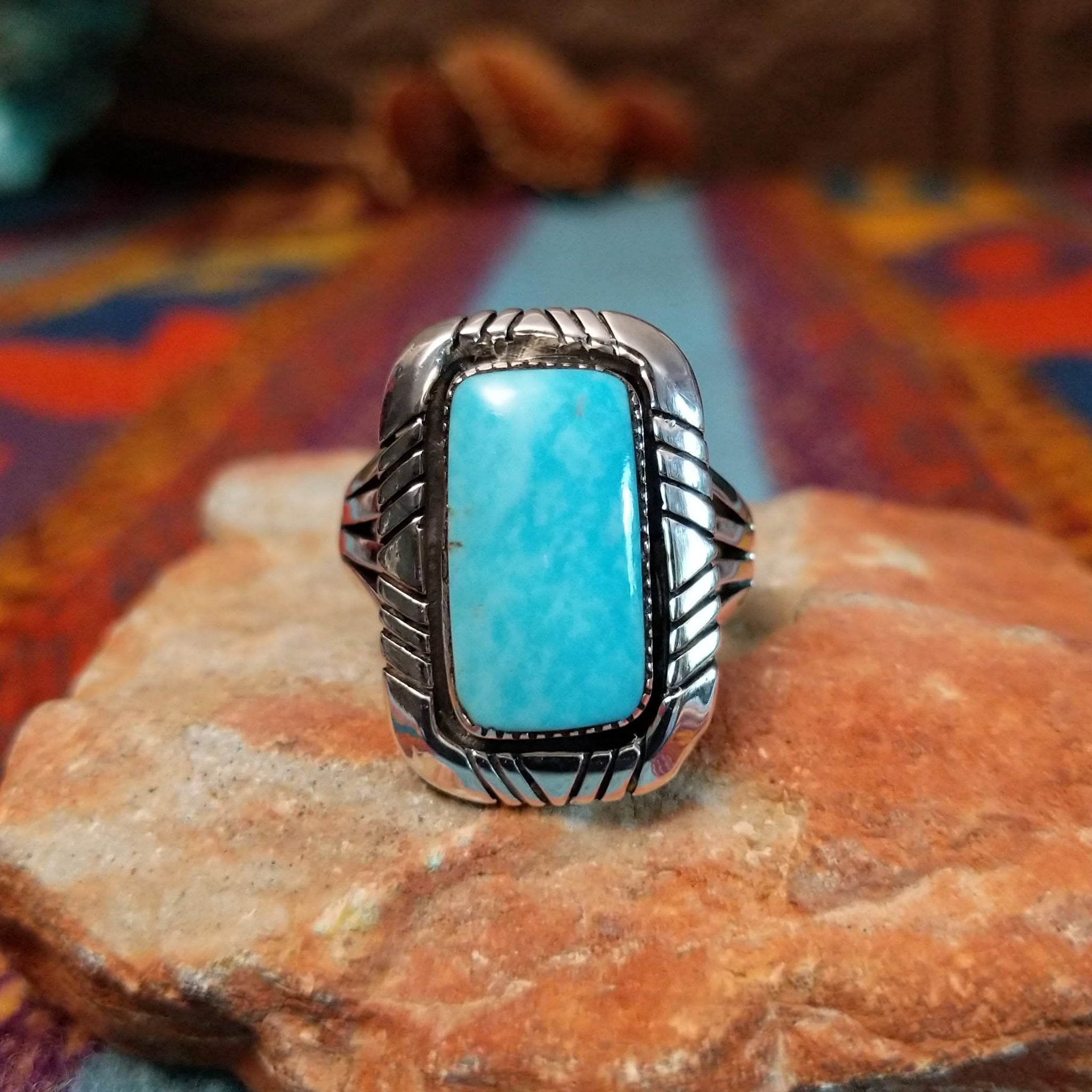 Navajo Turquoise Rectangle Ring featuring a large rectangular turquoise stone set in Sterling Silver with bold geometric stamped detailing and a split-shank band.