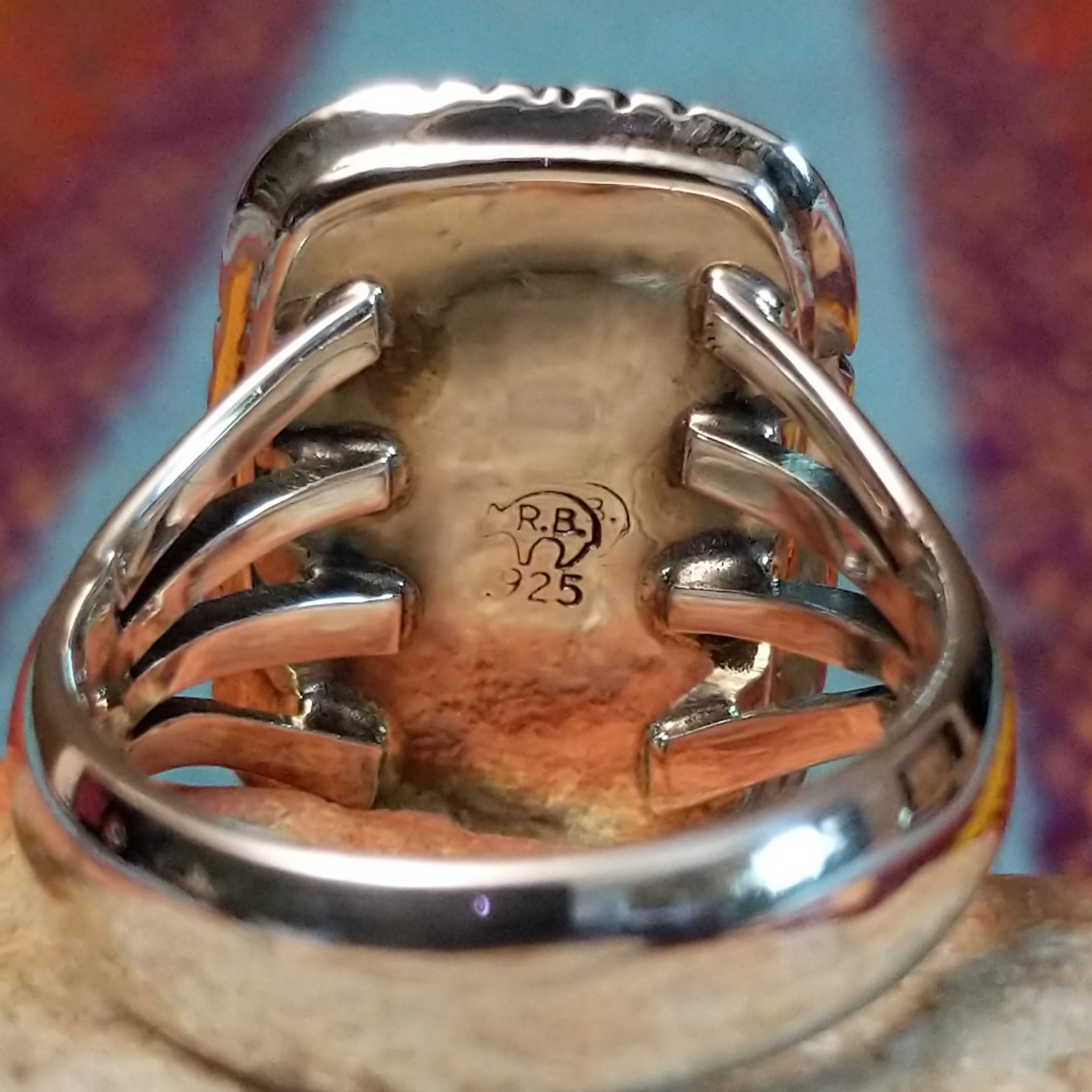 Navajo Turquoise Rectangle Ring featuring a large rectangular turquoise stone set in Sterling Silver with bold geometric stamped detailing and a split-shank band; artisan and .925 (Sterling Silver) stamp.