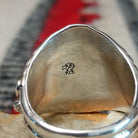 Close up of the artist's stamped signature