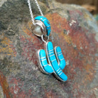 Handcrafted sterling silver turquoise inlay saguaro cactus pendant by B.J., featuring an inlay bale and traditional Navajo design; side view.
