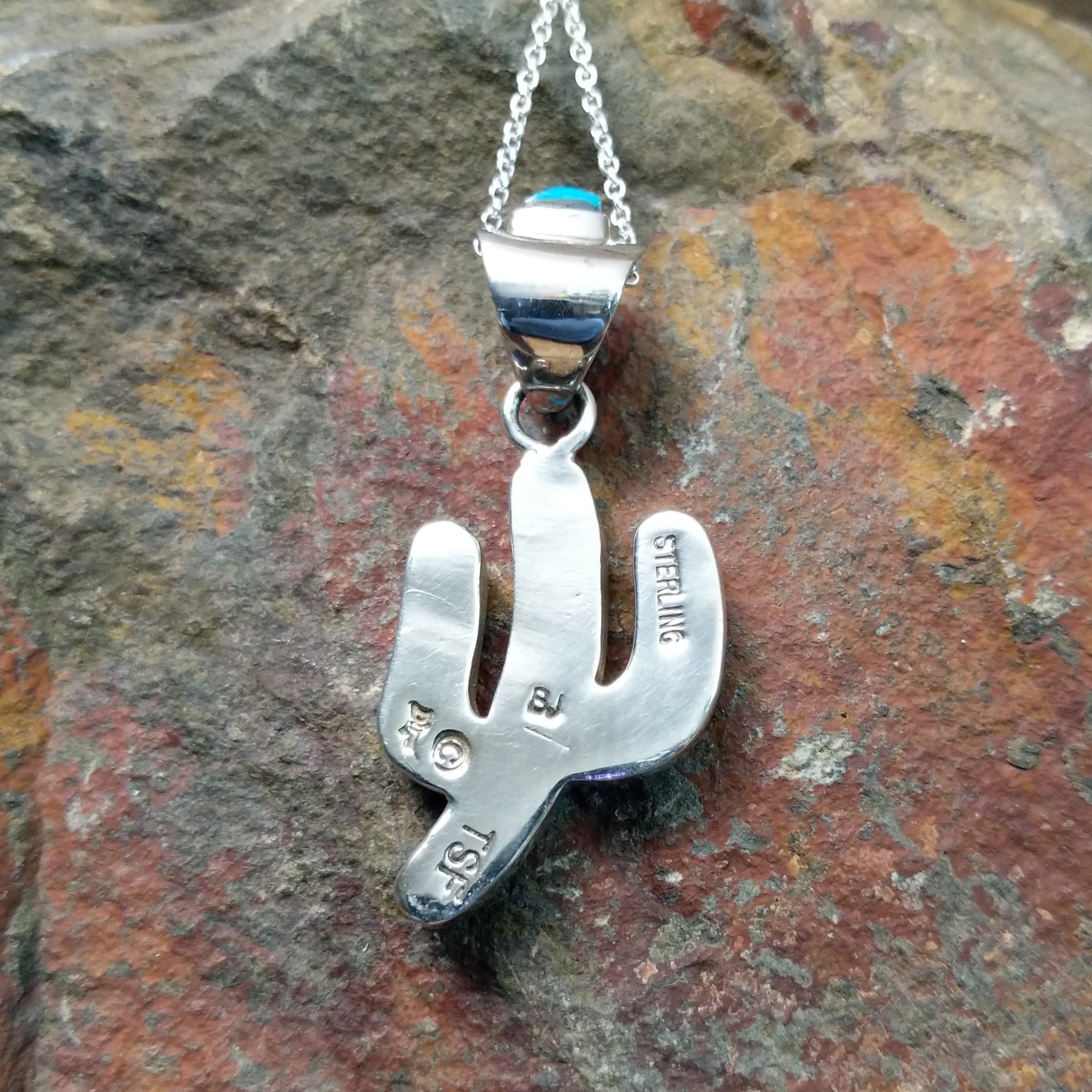 Handcrafted sterling silver turquoise inlay saguaro cactus pendant by B.J., featuring an inlay bale and traditional Navajo design; artisan and Sterling Silver stamp.