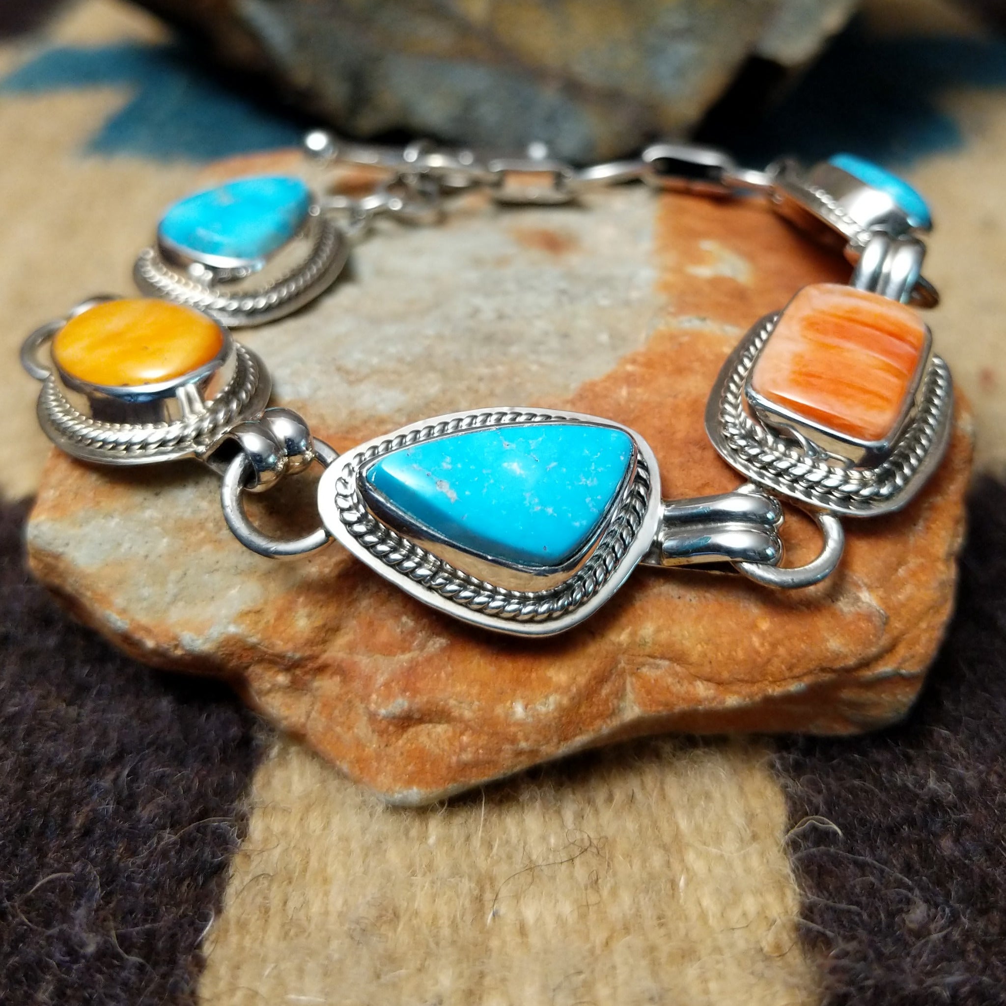 Navajo turquoise and spiny oyster link bracelet by L.P. with natural stones set in sterling silver.