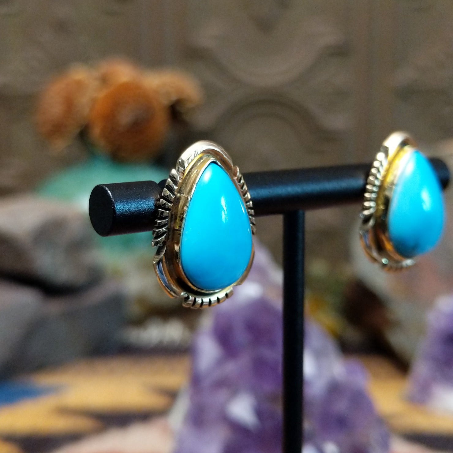 Navajo 14k gold teardrop earrings with turquoise stone and fan accents.