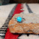 Navajo silver turtle ring with round turquoise stone.