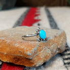 Navajo silver turtle ring with round turquoise stone.
