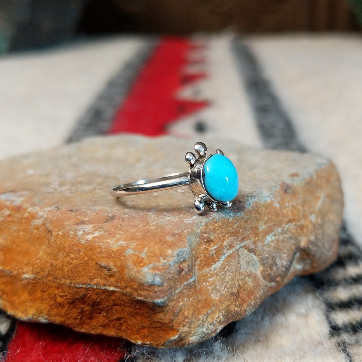 Navajo silver turtle ring with round turquoise stone.