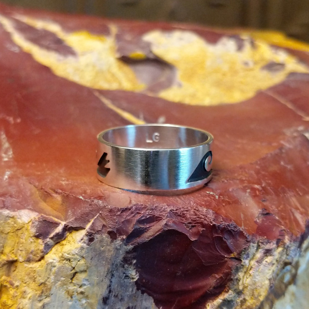Sterling silver ring with water waves and rain clouds along the surface.