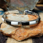 Navajo White Buffalo link bracelet by M.T. with black and white inlay set in sterling silver.