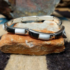 Navajo White Buffalo link bracelet by M.T. with black and white inlay set in sterling silver.