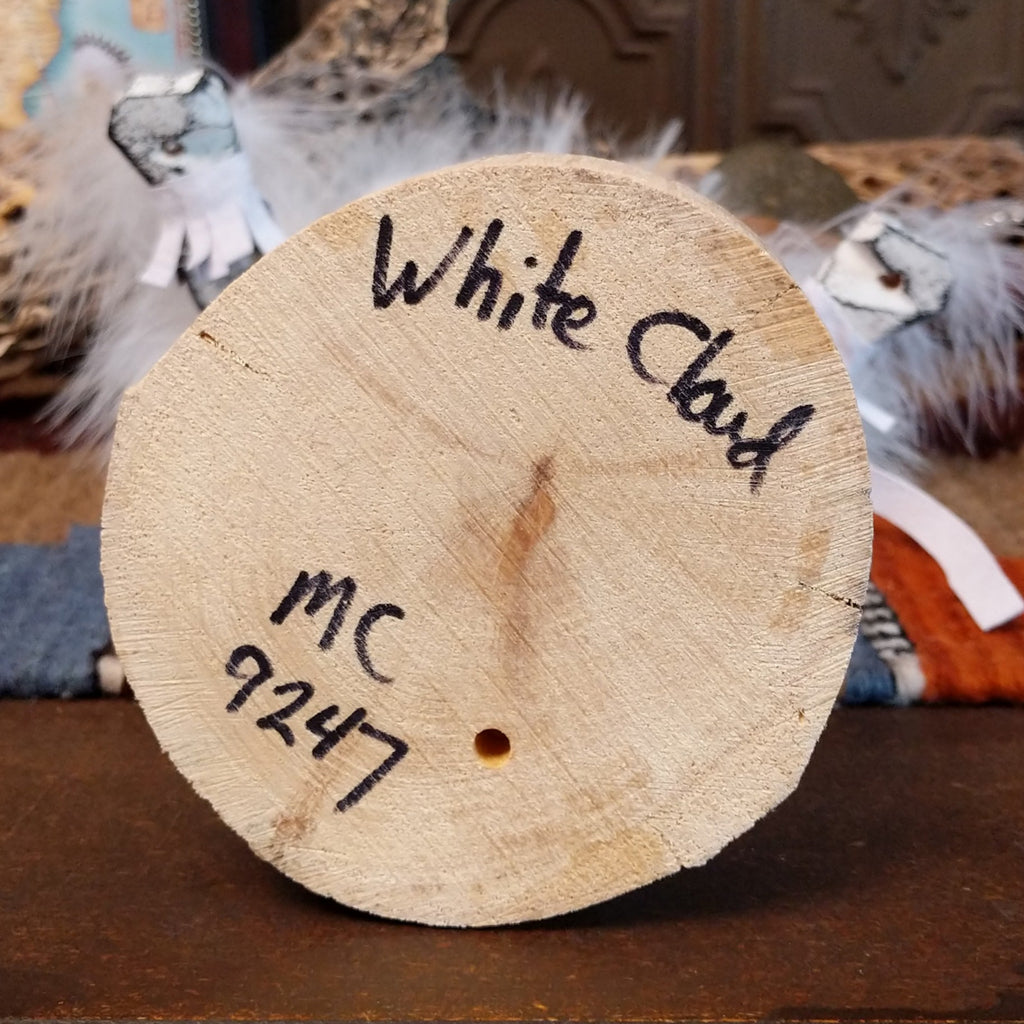 The underside of the base features the title and initials of the artisan.