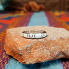 Navajo silver band ring with inlaid white manmade opal inlay.