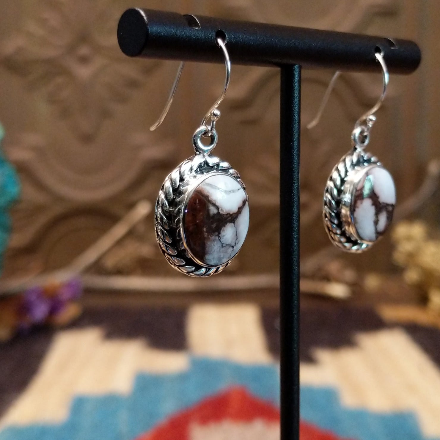 Sterling silver dangle earrings with wild horse stones set in the bezels, framed by twisted rope accents.