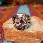 Navajo Wild Horse Ring with rectangular stone and geometric silver detailing.