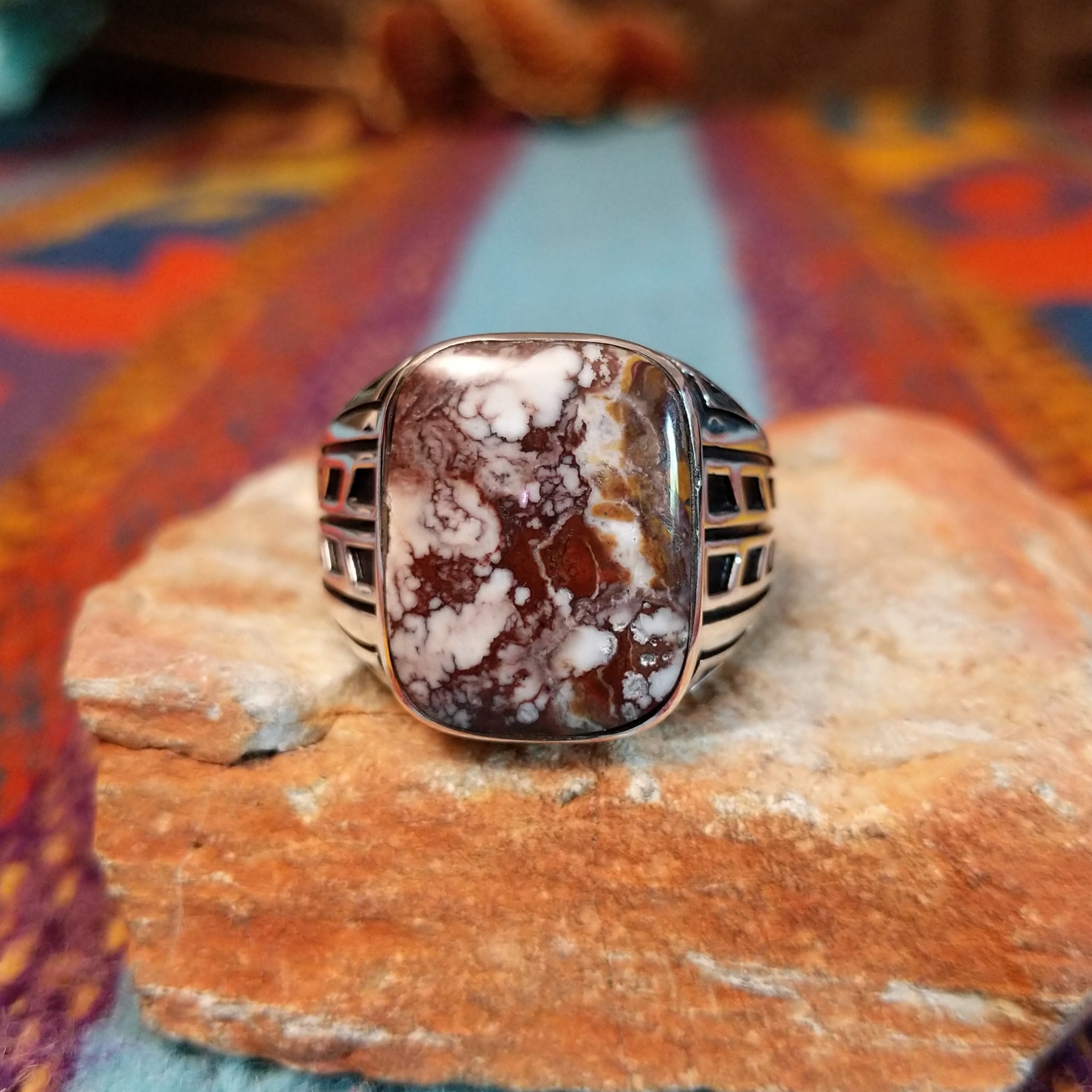 Navajo Wild Horse Ring with rectangular stone and geometric silver detailing.