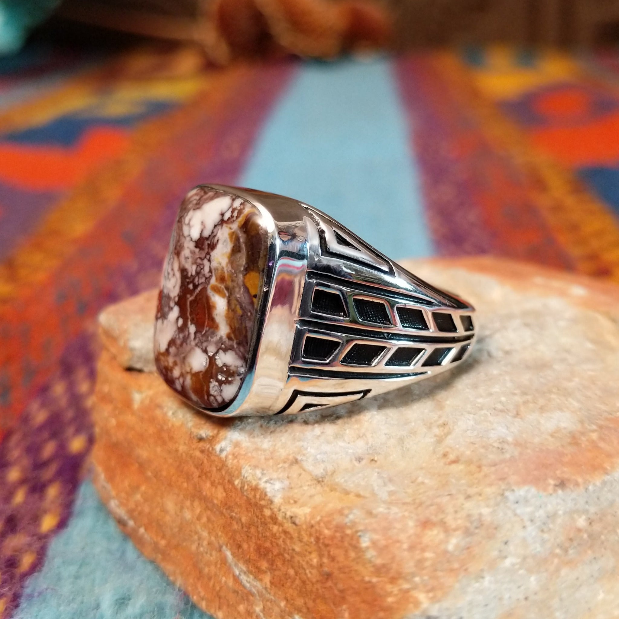 Navajo Wild Horse Ring with rectangular stone and geometric silver detailing.