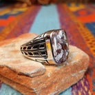 Navajo Wild Horse Ring with rectangular stone and geometric silver detailing.