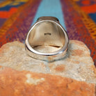 Navajo Wild Horse Ring with rectangular stone and geometric silver detailing.