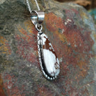 Handcrafted sterling silver Navajo Wild Horse teardrop pendant featuring a natural Wild Horse gemstone in a classic bezel setting; side view.