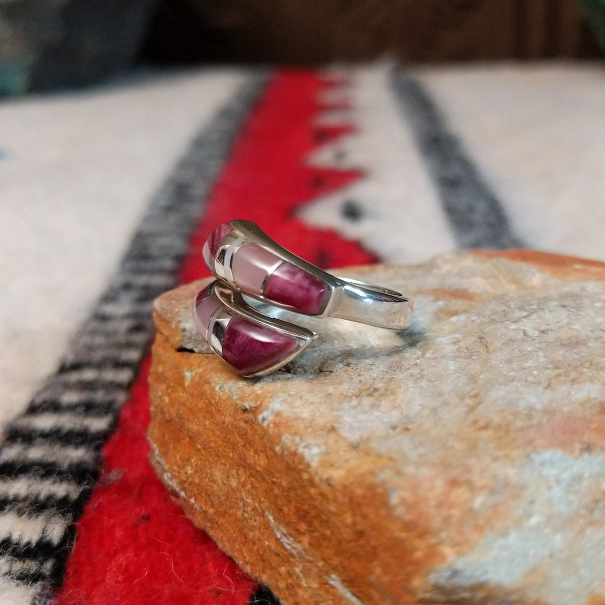 Navajo wrap ring by J.B. with pink and purple multistone inlay.