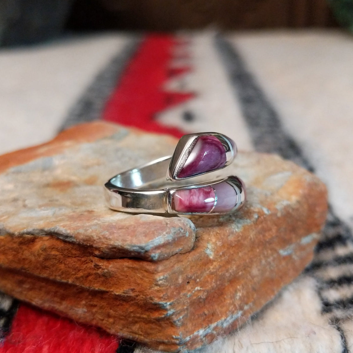 Navajo wrap ring by J.B. with pink and purple multistone inlay.