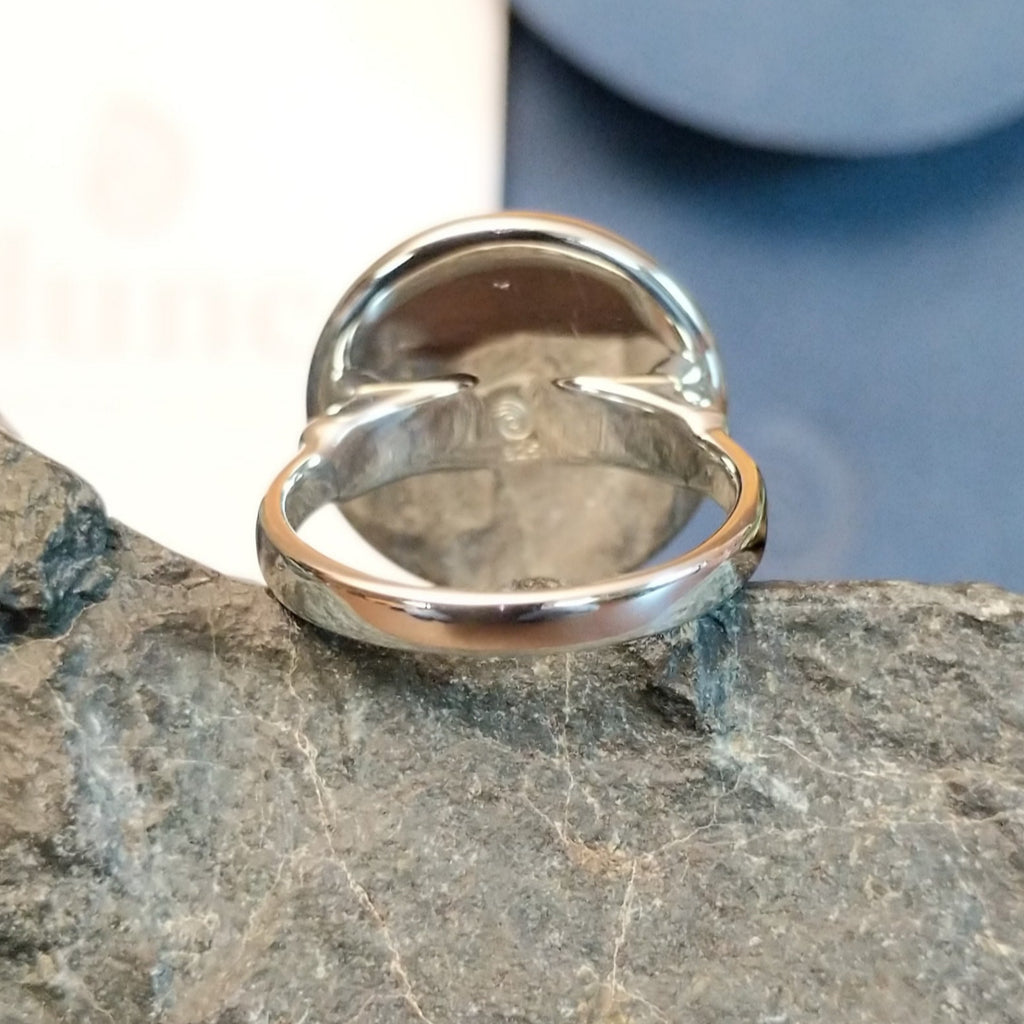 The back of the ring showcases the polished sterling silver band.