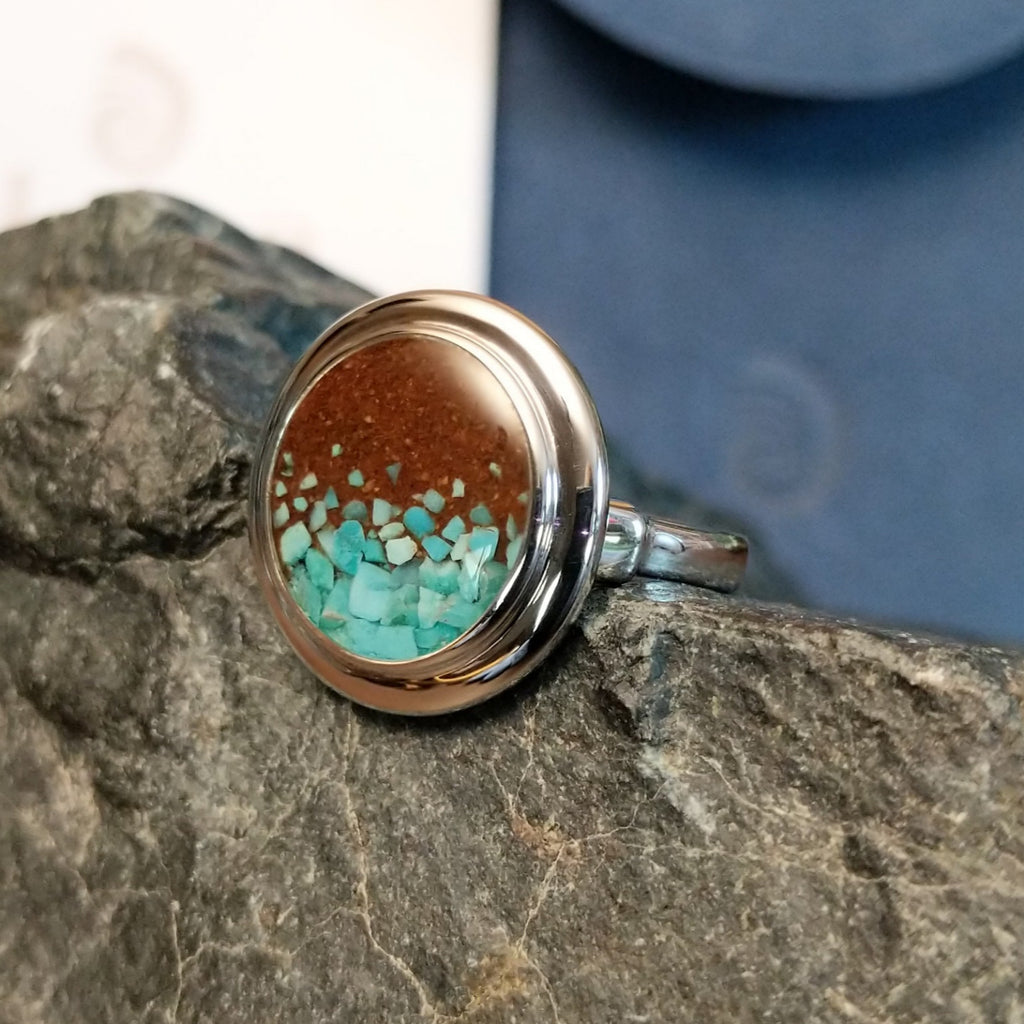 Turquoise flakes and Lake Powell sand set in round sterling silver bezel of the ring.
