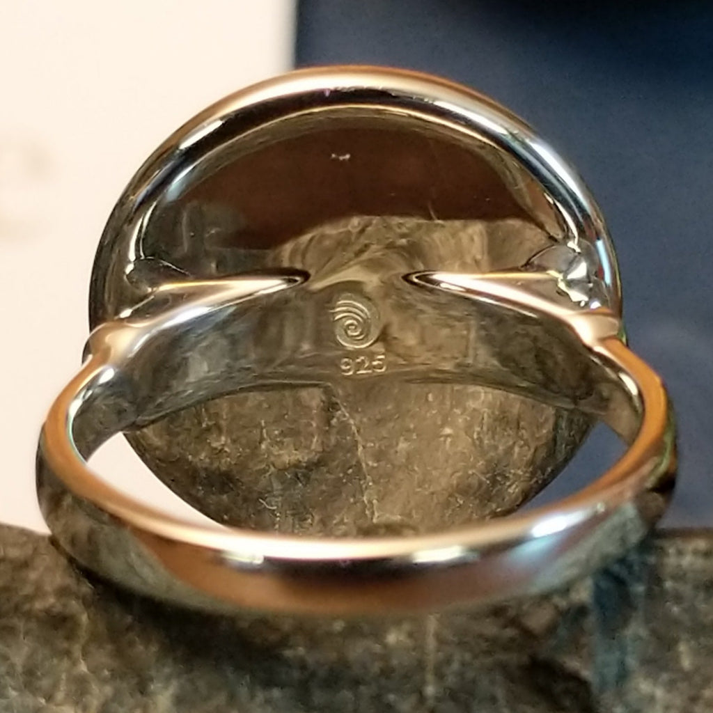 A close-up of the silver authentication and trademark.