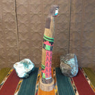 The shalako kachina features the vibrant colors and starry night patterns on the side.