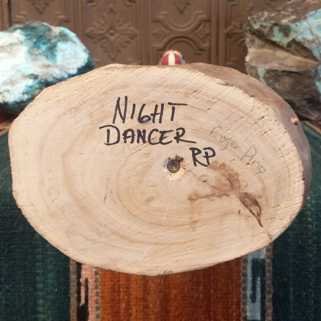 The artisan's signature and piece title is found on the base.