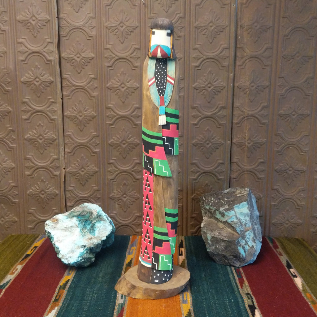 The front of the shalako kachina features the vibrant colors and face of the figure.