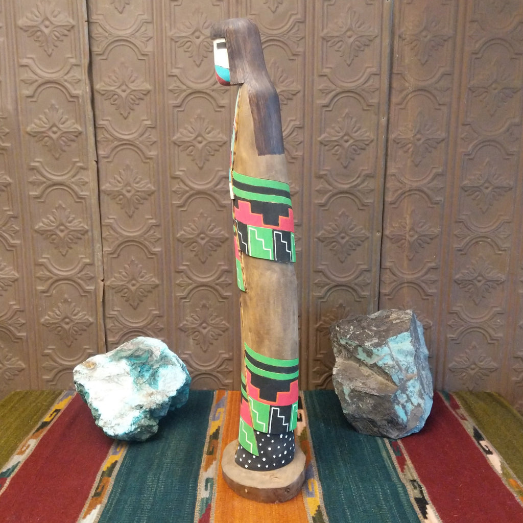 The shalako kachina features the vibrant colors and starry night patterns on the side.