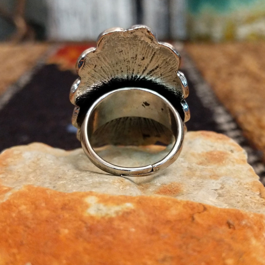 The back of the ring showcases its adjustable band for larger sizing.