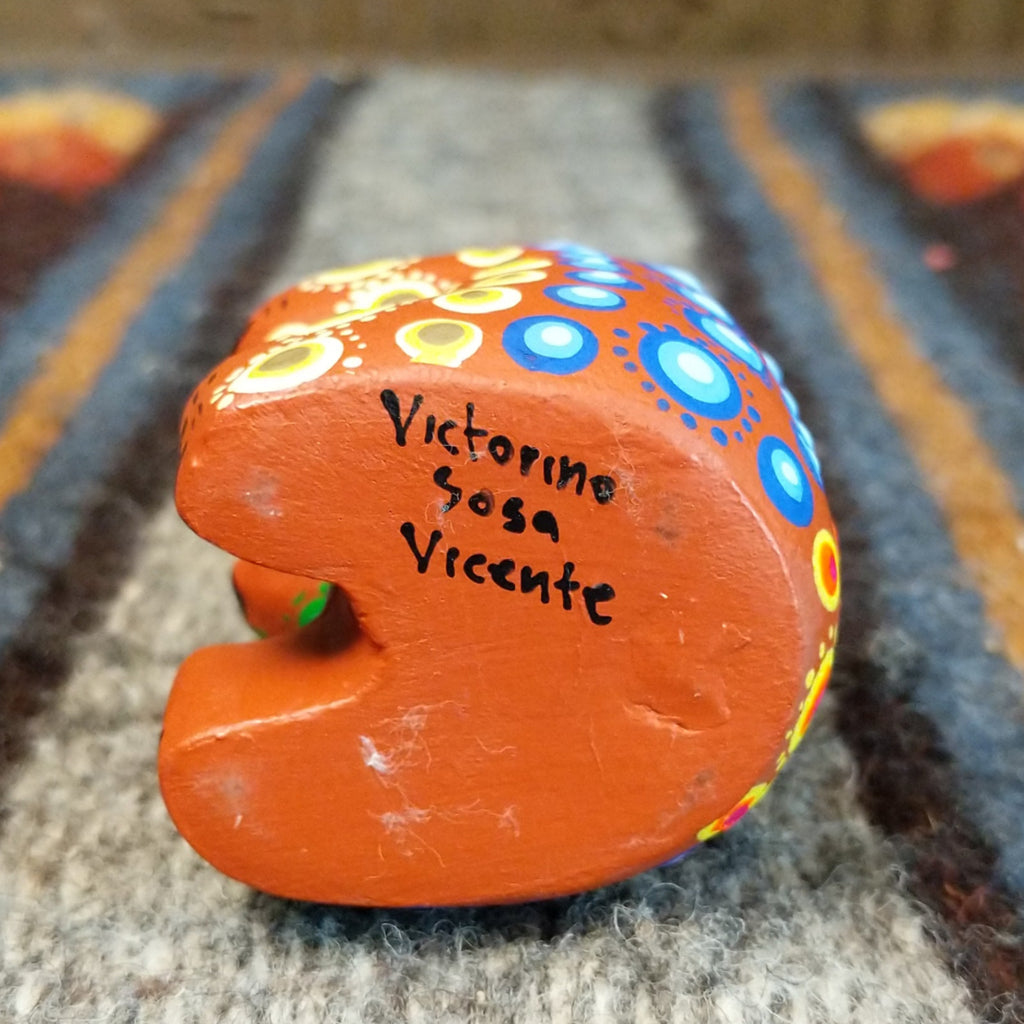 Artists signature is signed at the bottom of the bear.