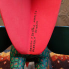 Artists signatures on the back of the eagle's tail feathers.