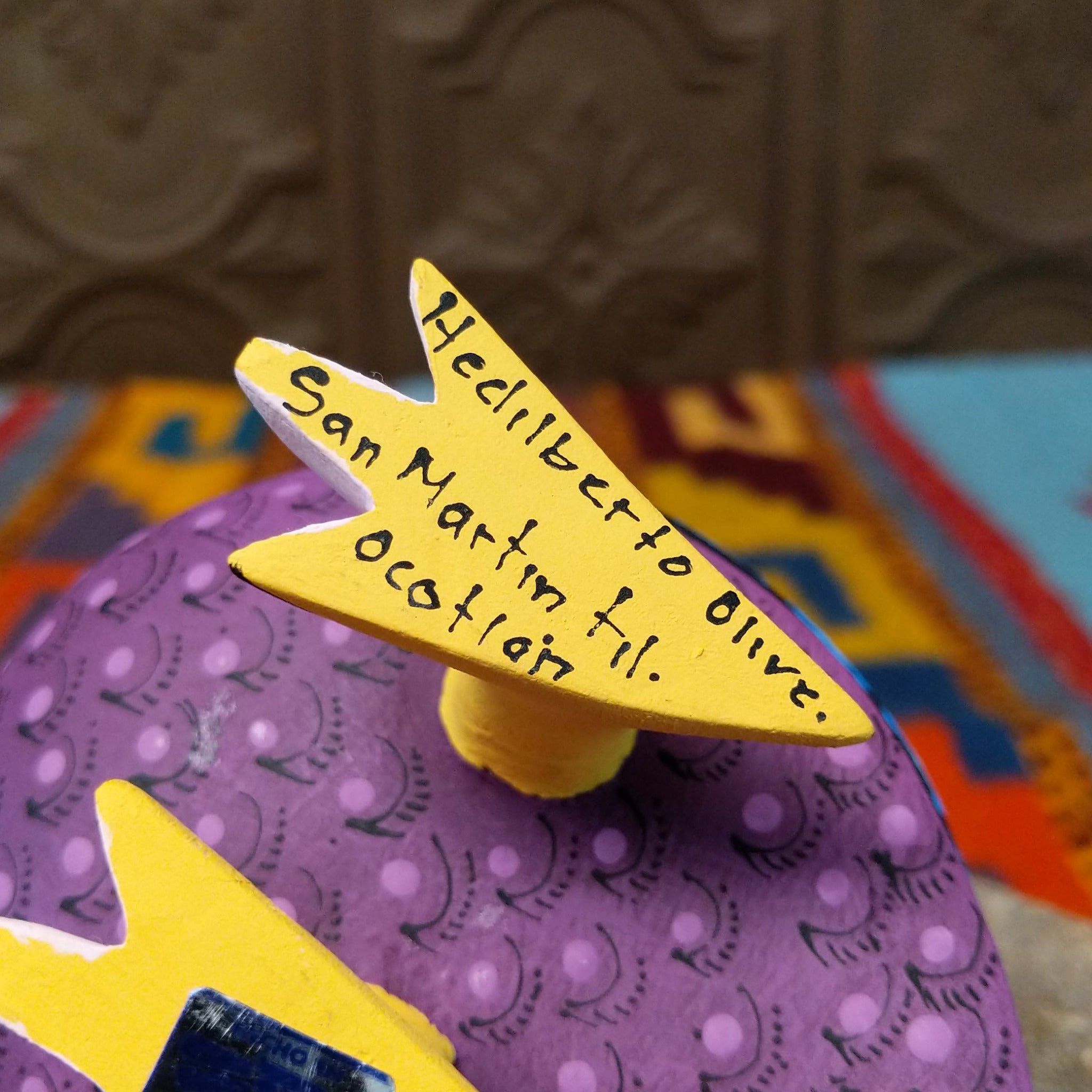 Base of Oaxacan bird wood carving signed by artist Hedilberto Olivera of San Martín Tilcajete, Oaxaca.